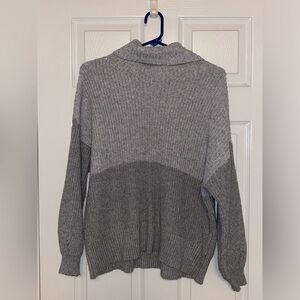 Grey, long, turtle neck sweater.